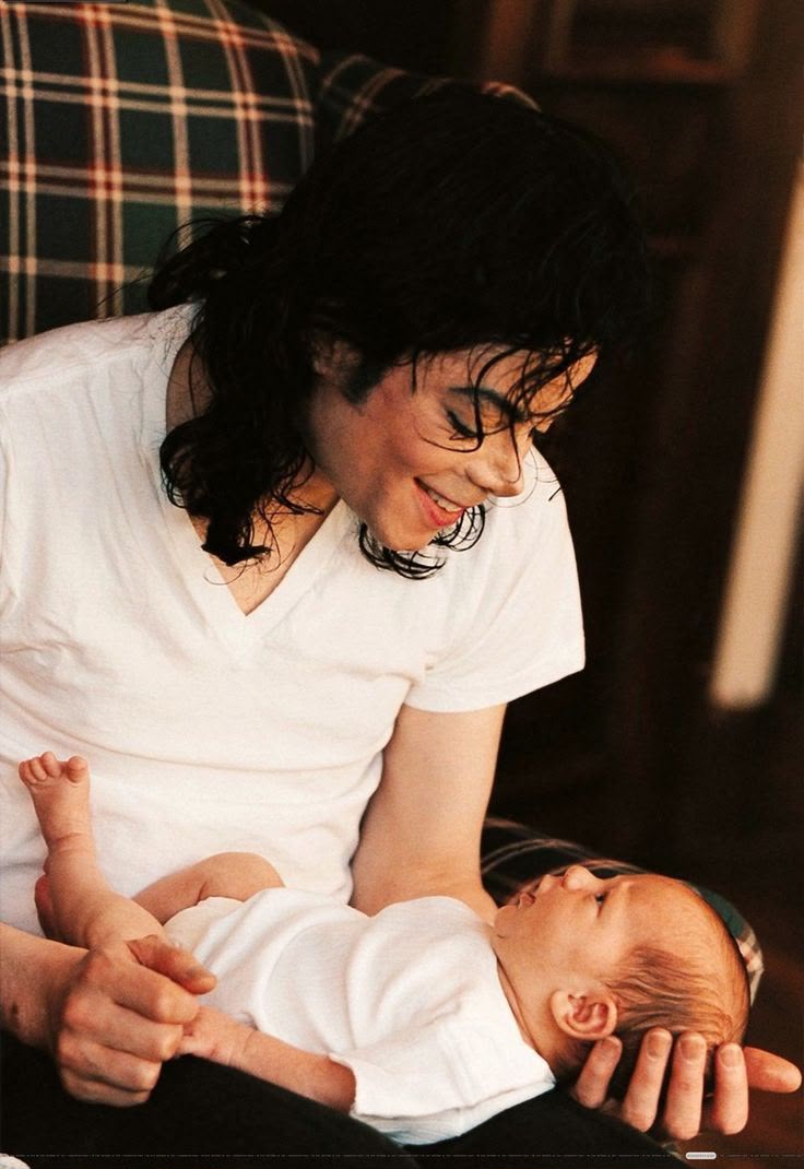 Michael Jackson with his children — Prince, Paris and Blanket — at a park in Bahrain. A father with his kids, the side of Michael the tabloids rarely showed.